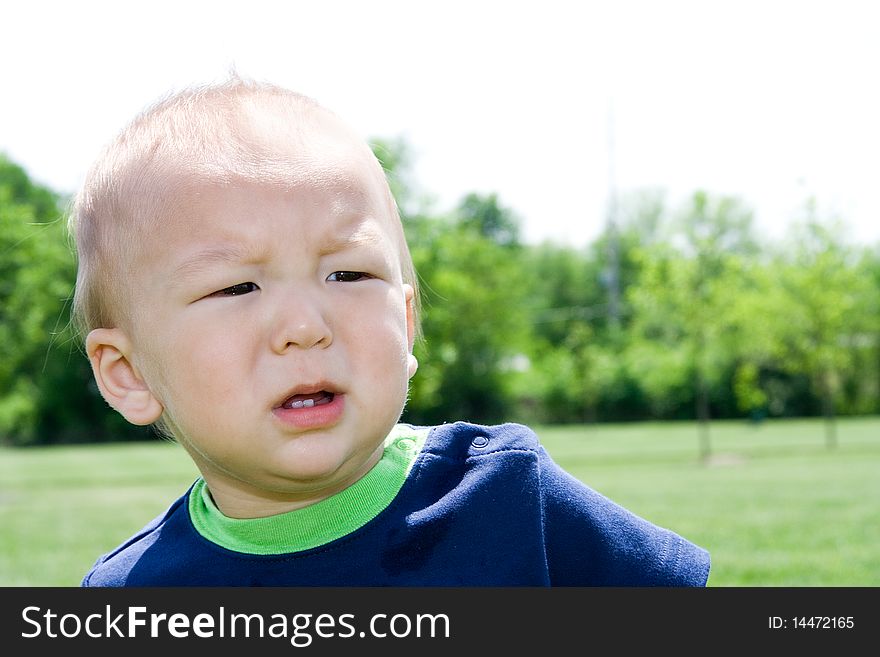 Unhappy Asian American multiethnic boy about to throw a tantrum or looking confused. Unhappy Asian American multiethnic boy about to throw a tantrum or looking confused.