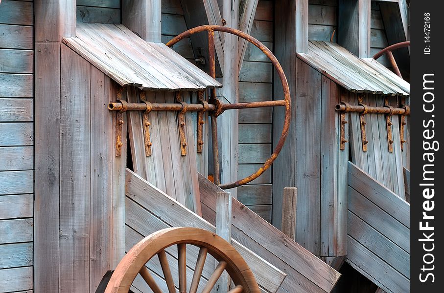 Aged mill running equipments, made by wood, shown as interesting geometry shape and aged color.