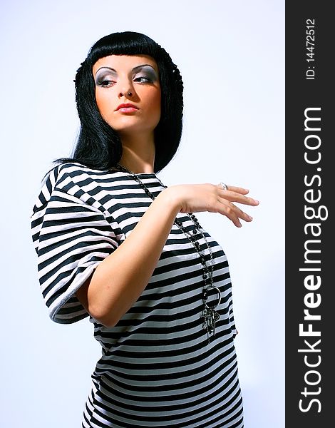 Attractive fashion woman posing in a striped top