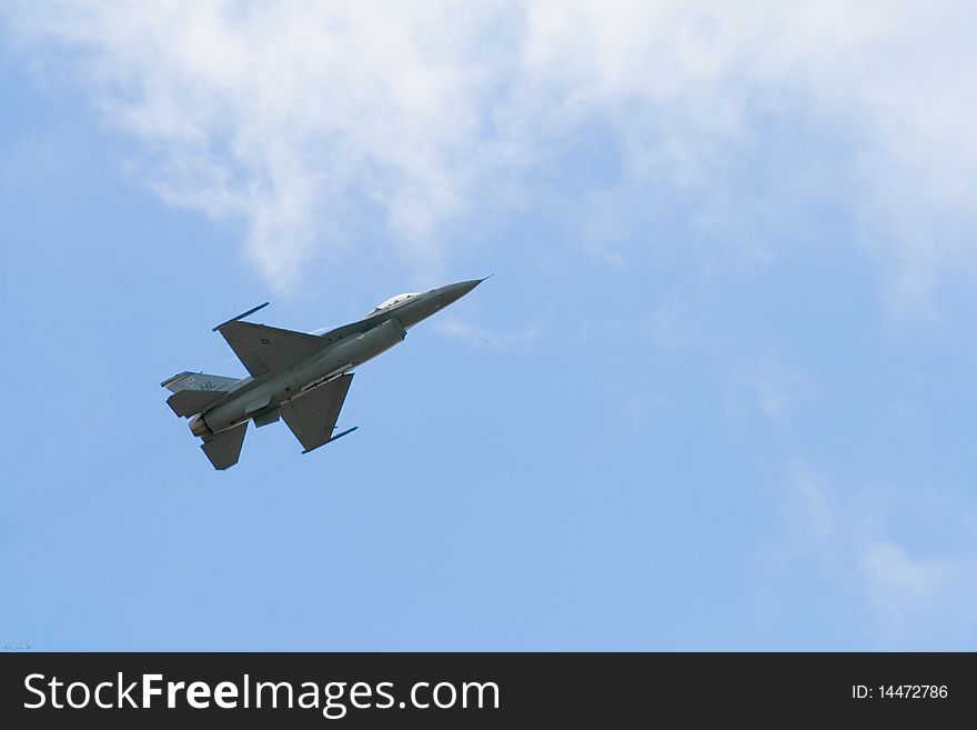 An F-16 fighter jet flying into the cloud at 2009 MCAS Miramar Airshow. An F-16 fighter jet flying into the cloud at 2009 MCAS Miramar Airshow
