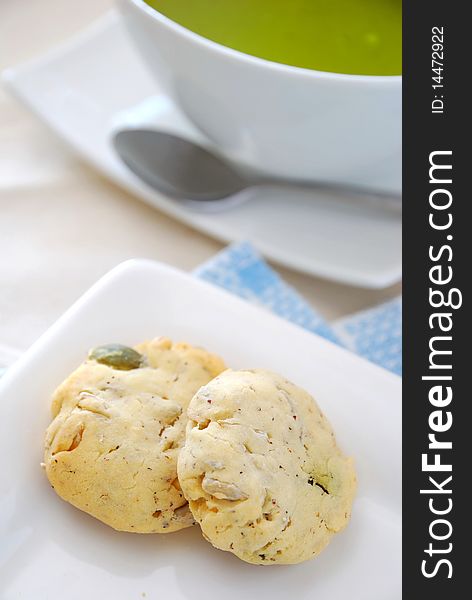 Healthy cookies on white plate with utensils. Filled with nutritious nuts for a healthy afternoon snack or high tea. Concepts such as food and beverage, diet and nutrition, and healthy lifestyle. Healthy cookies on white plate with utensils. Filled with nutritious nuts for a healthy afternoon snack or high tea. Concepts such as food and beverage, diet and nutrition, and healthy lifestyle.