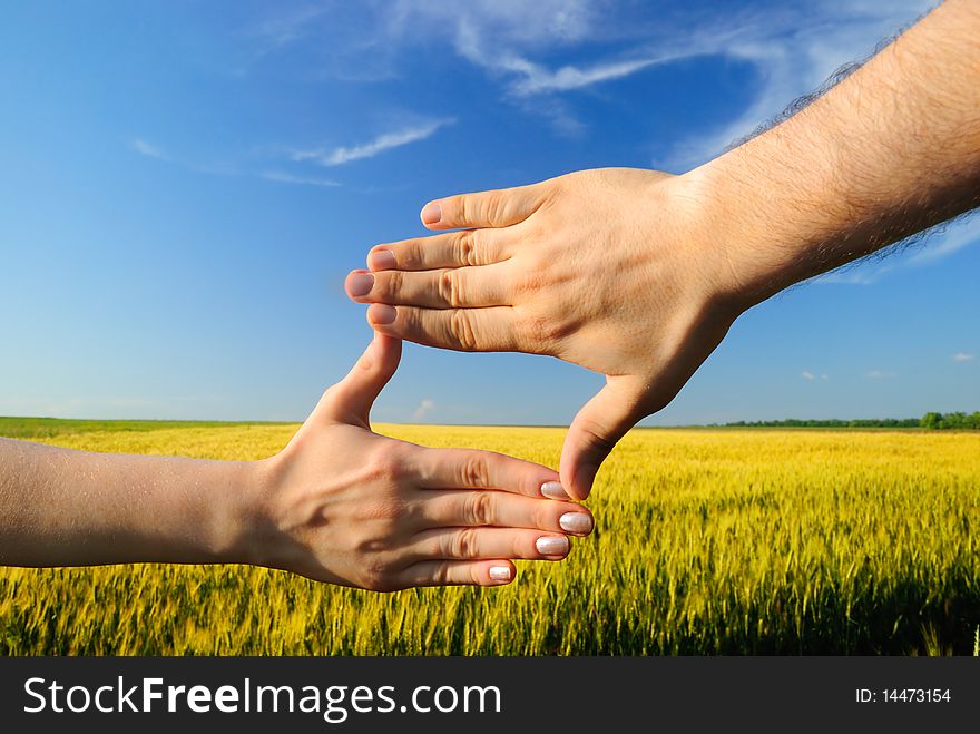 Hands Against A Field