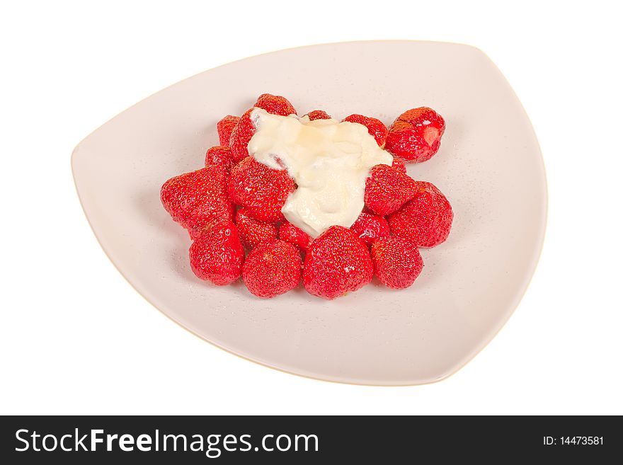 Strawberry with sugar and cream on a white plate. Strawberry with sugar and cream on a white plate