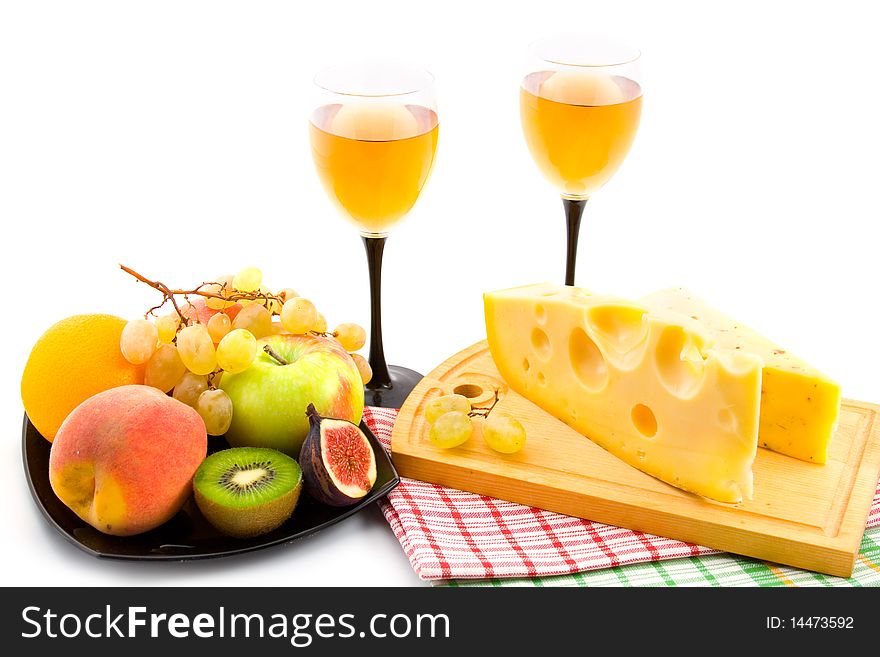 Wine, cheese and fruits isolated on white