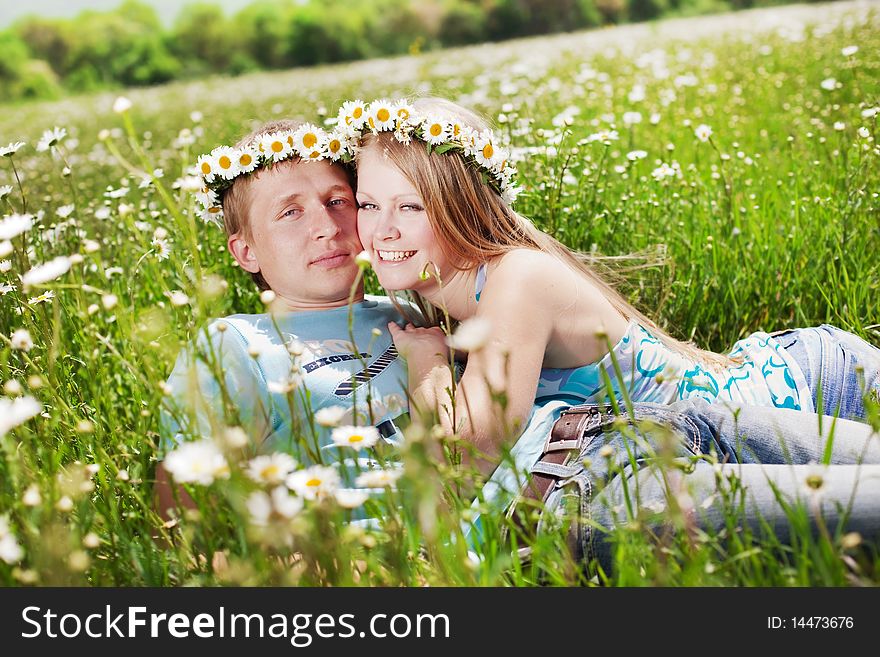 Pretty young couple in the fields