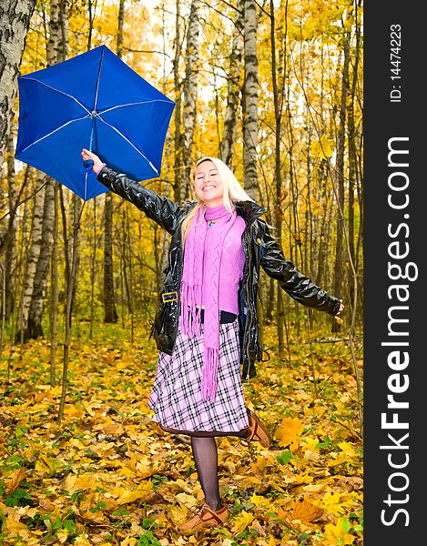 Young smiling woman with umbrella. Young smiling woman with umbrella