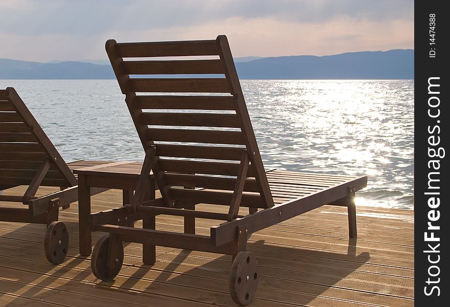 Easy chair on beach in sunset. Easy chair on beach in sunset