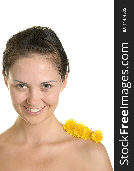 Three flowers on shoulder at smiling woman isolated in white