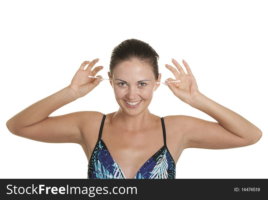 Smiling woman cleans ears two cotton buds isolated in white