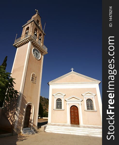 Wide angle portrait view of Greek chapel and bell tower. Wide angle portrait view of Greek chapel and bell tower