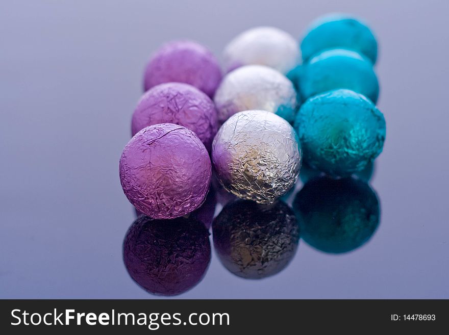 Different colored chocolate balls covered in foil