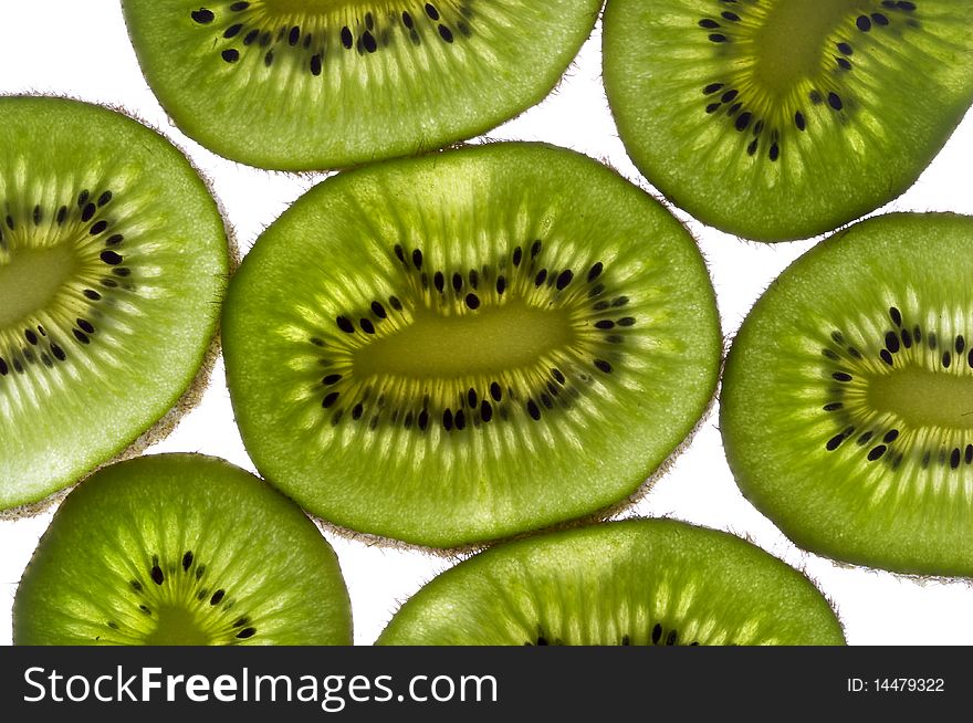 Sliced kiwi with backlight macro shot background. Sliced kiwi with backlight macro shot background