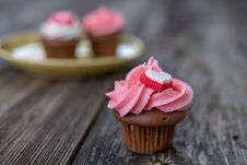 Pink And White Muffins With Heart On Wooden Ground Royalty Free Stock Image