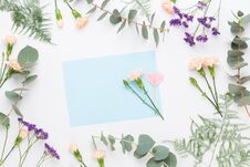 Flowers Composition. Paper Blank, Carnation Flowers, Eucalyptus Branches On Pastel Background. Flat Lay, Top View, Copy SpaceFlat Royalty Free Stock Photo Flowers Composition. Paper Blank, Carnation Flowers, Eucalyptus Branches On Pastel Background. Flat Lay, Top View, Copy SpaceFlat Royalty Free Stock Photo