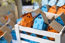 Free Paper Houses In Different Colors, Orange, Blue, Cyan Inside Wooden Frame Stock Photos - 144769873