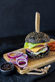 Juicy Double Cheeseburger. Side View, Black Background, Space For Text. Stock Photography