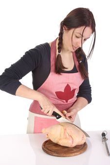 Beautiful Housewife Cutting Chicken Royalty Free Stock Image