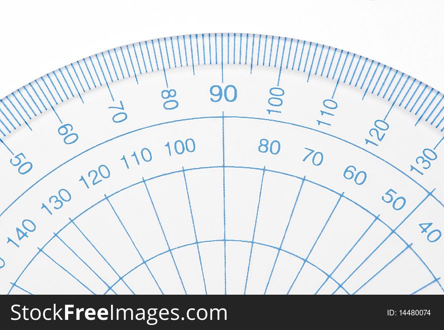 Close Up capturing a portion of a transparent plastic protractor arranged over white. Close Up capturing a portion of a transparent plastic protractor arranged over white.