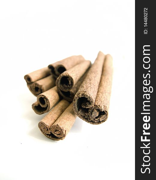 Few cinnamon sticks on white background