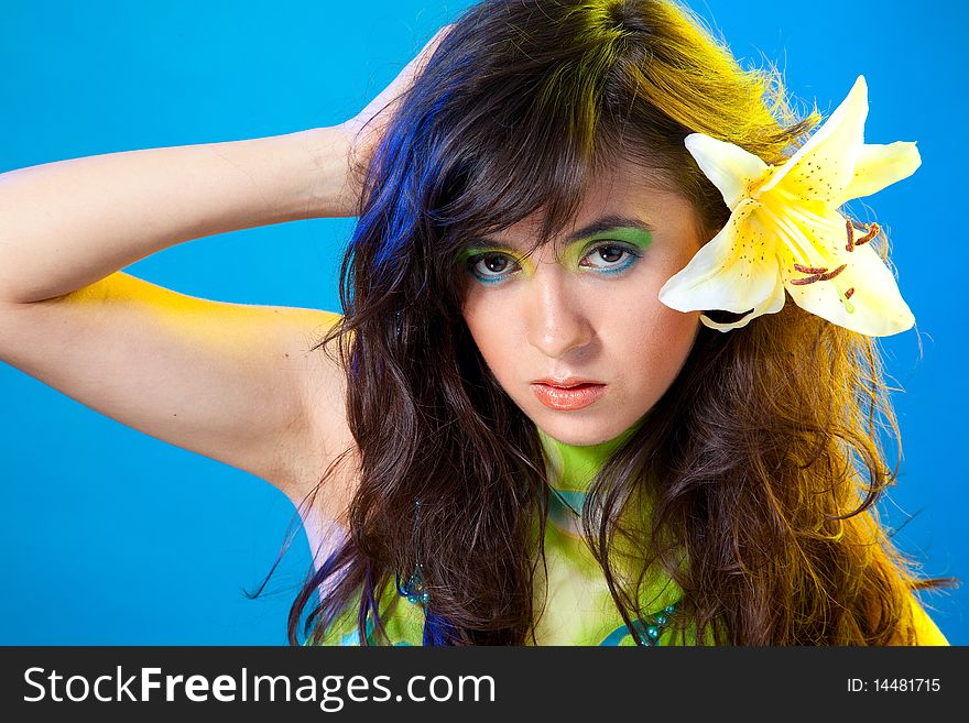 Young fashion model women over blue background