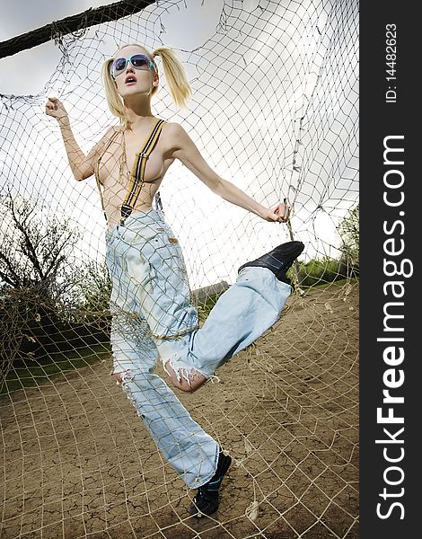 Fashion Model Behind Net Webbing