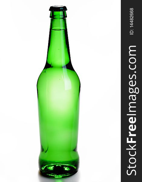 Green bottle with a drink isolated on white