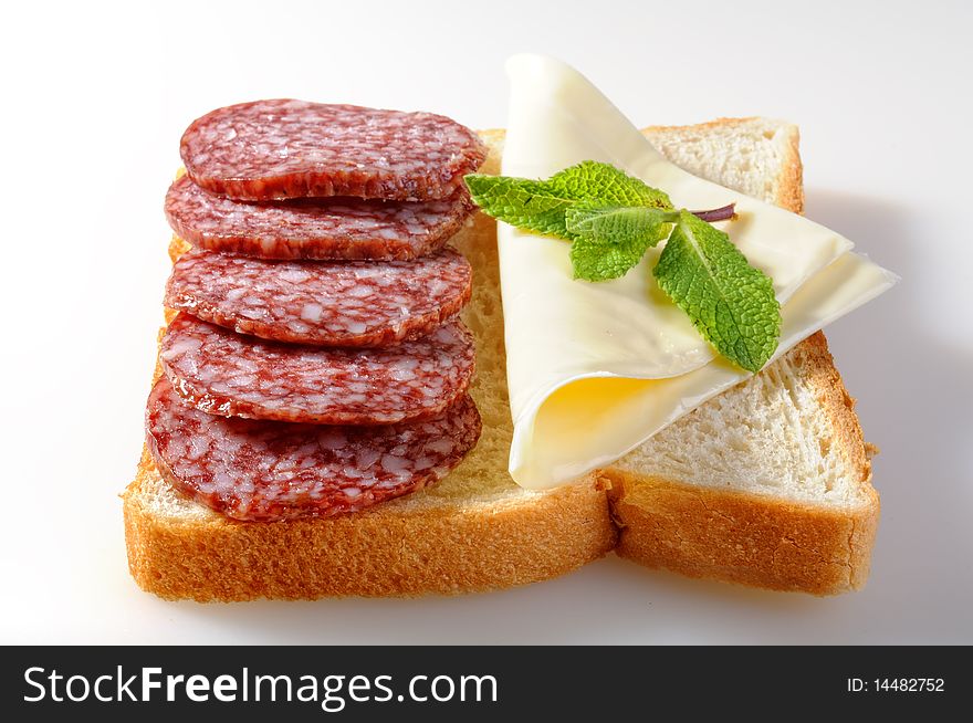 Salami sandwich isolated on white