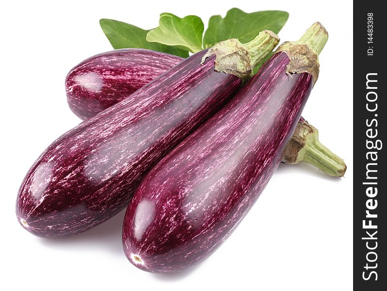 Purple eggplants with leaves on white background