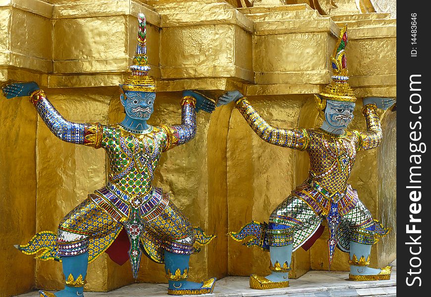 Statue of demon guardians at the Buddhist temple of Wat Phra Kaeo at the Grand Palance in Bangkok, Thailand. Statue of demon guardians at the Buddhist temple of Wat Phra Kaeo at the Grand Palance in Bangkok, Thailand.