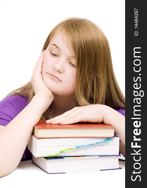 Unhappy young girl with books isolated. Unhappy young girl with books isolated