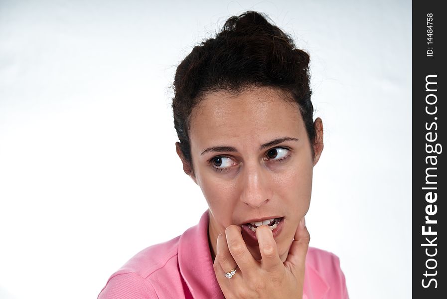 Concerned woman, biting her finger. Concerned woman, biting her finger