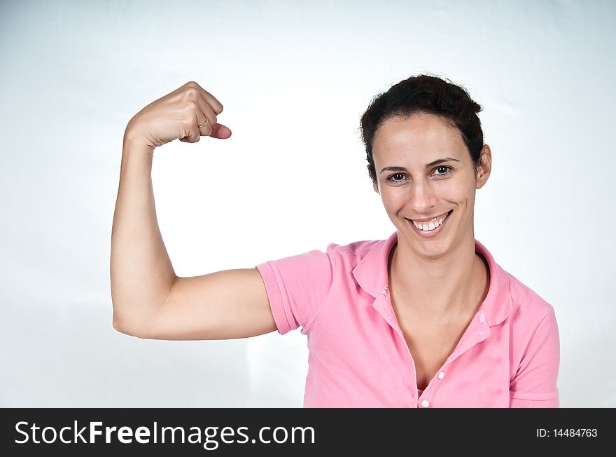 Smiling woman, flexing her bicep muscle. Smiling woman, flexing her bicep muscle