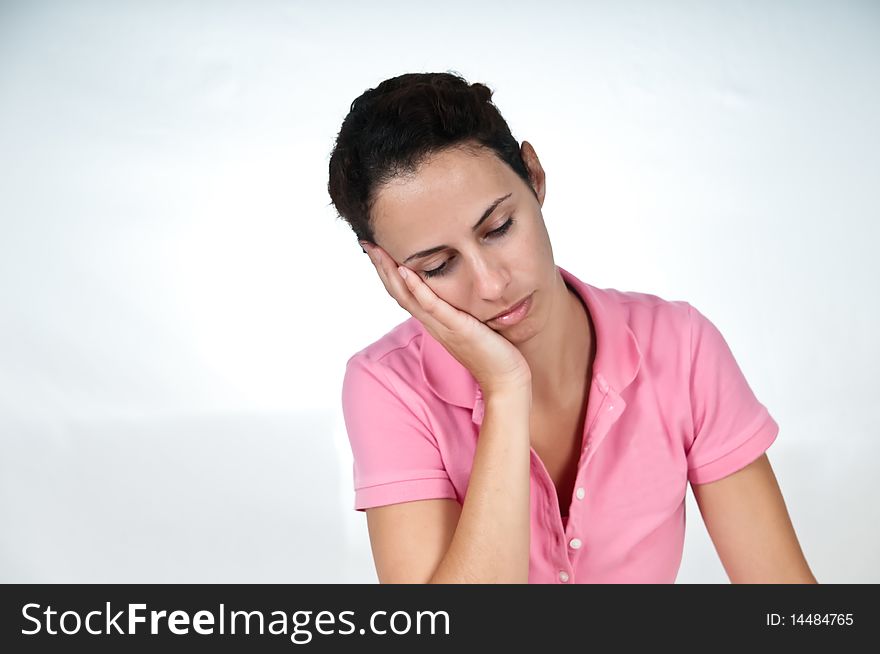 Depressed woman resting head in her hand. Depressed woman resting head in her hand
