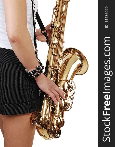 A young Asian woman standing in the studio, playing the saxophone in shorts with suspender, in closeup, for white background. A young Asian woman standing in the studio, playing the saxophone in shorts with suspender, in closeup, for white background.