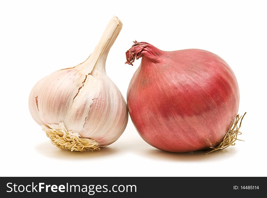 Fresh garlic and onion on white background