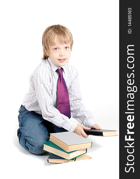 Young boy with books isolated