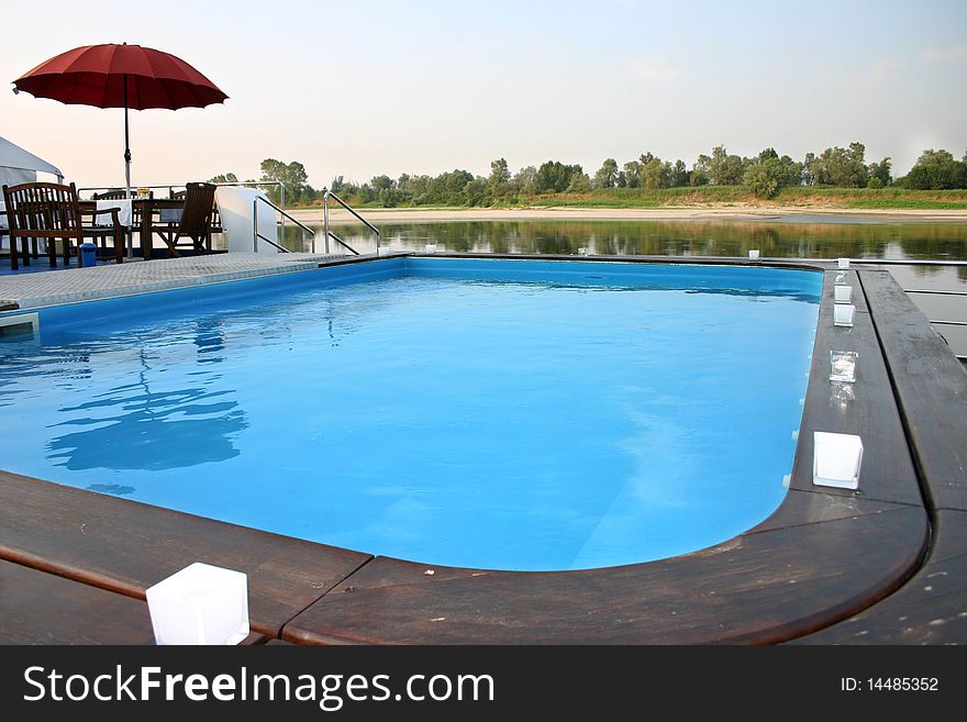 Swimming pool during cruise on a river. Swimming pool during cruise on a river