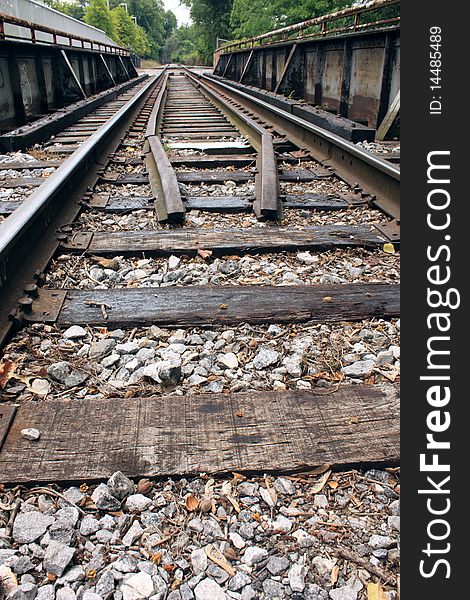 Low angle of railroad tracks crossing a small bridge. Low angle of railroad tracks crossing a small bridge.