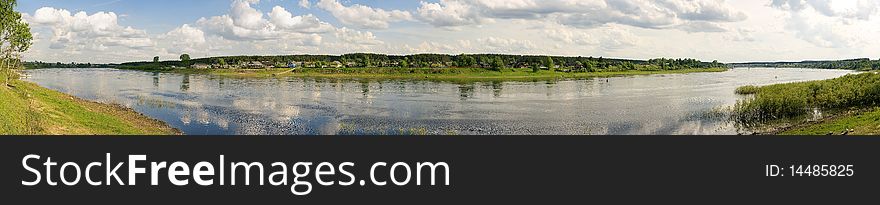 Panorama of a summer landscape with the river,wood and village.
River - Suhona - big river in Vologda region (Russia)
The total image is made of 34 shots.