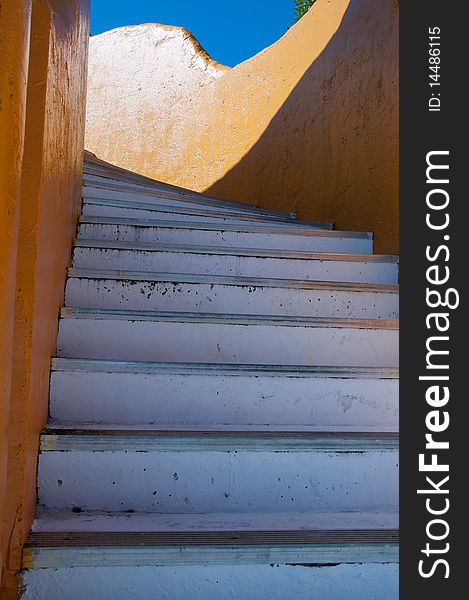 Staircase on orange building in the Bahamas