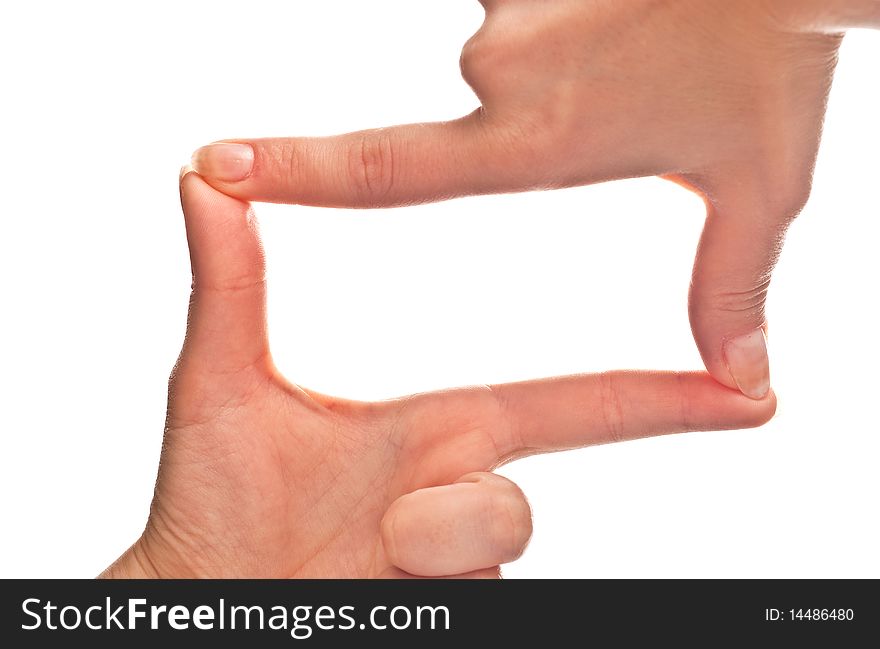 Female hands forming a frame. Isolated on a white background. Female hands forming a frame. Isolated on a white background.