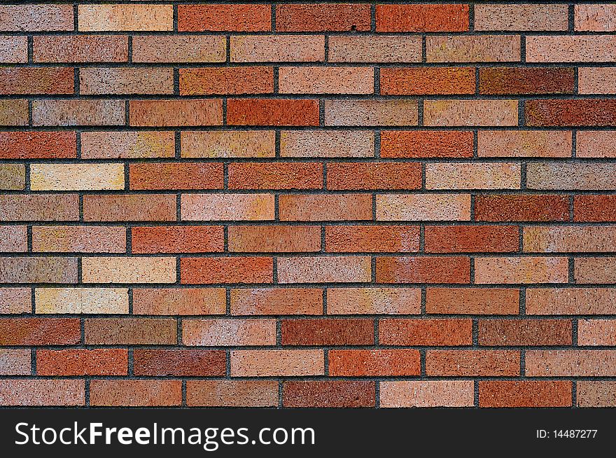 Clean red and tan brick wall background texture.