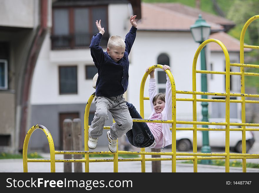 Happy family sister and brother have fun and play games outdoor in park. Happy family sister and brother have fun and play games outdoor in park