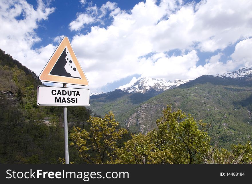 Picture of apline landscape with signal of falling rocks. Picture of apline landscape with signal of falling rocks