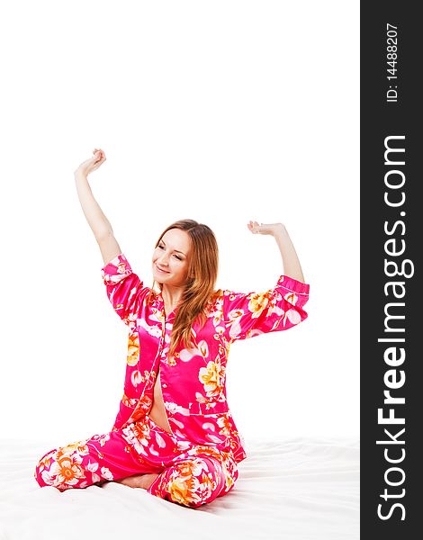 Picture of a morning sweet young girl in pink pajamas on bed