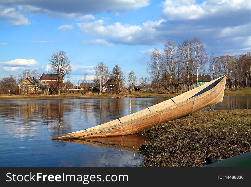 Against village boat in water