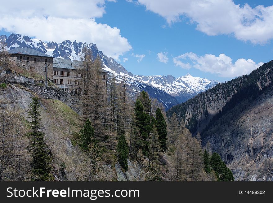 Rocky mountain landscape in Alps with hostel, France.