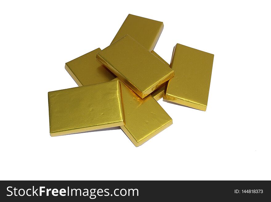 Fresh chocolate gold bars in white bg