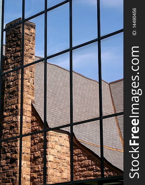 Church reflection in a glass window