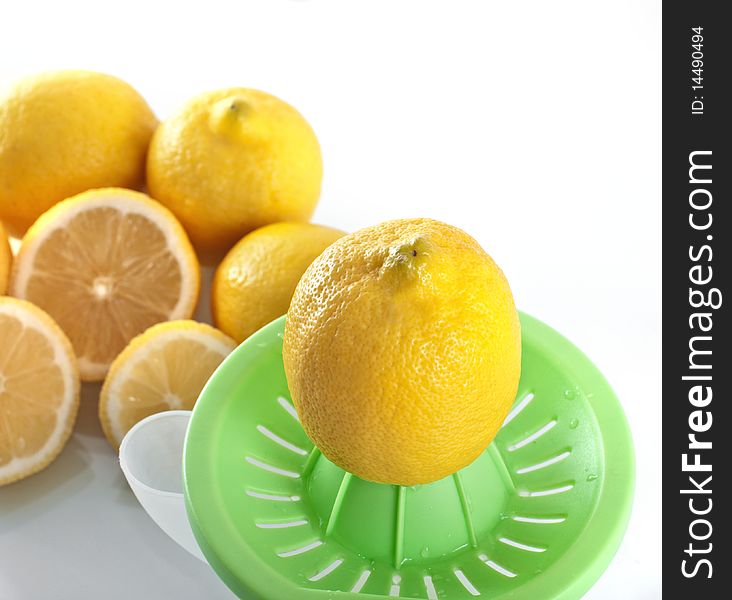 Lemons with squeezer , isolated on white background